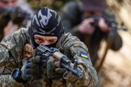 A potential recruit who aspires to join the Third Separate Assault Brigade of the Ukrainian Armed Forces takes part in a military course, in central Kyiv [File: Valentyn Ogirenko/Reuters]