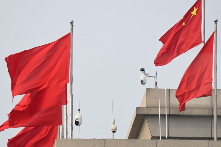 Chinese flags and surveillance cameras