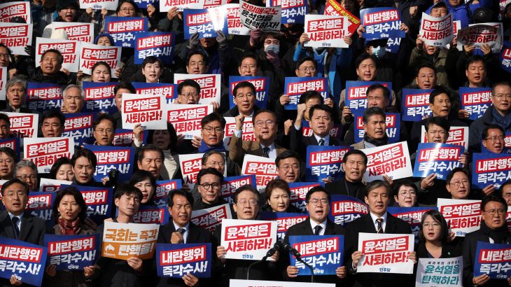 South Korea's main opposition Democratic Party leader Lee Jae-myung, lawmakers and people attend a rally to condemn South Korean President’s surprise declarations
