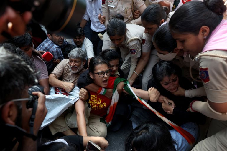 Neha Bora, National President of the All India Students' Association (AISA), reacts as she is detained by police during a protest demanding the resignation of India's Chief Election Commissioner Gyanesh Kumar, in New Delhi, India, October 2, 2026. REUTERS/Bhawika Chhabra